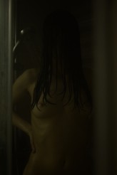bluszcz Woman in the shower, dark mood.